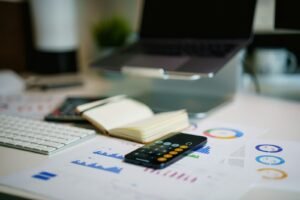 Small business owner calculating digital marketing budget and costs